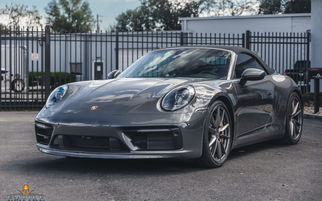 Paint Protection Film (PPF) on a gray Porsche 911 Targa 4S car. PPF is a clear, transparent film that protects the car's paint from scratches, chips, and other damage. It is a popular option for car owners who want to keep their car's paint looking new for years to come.