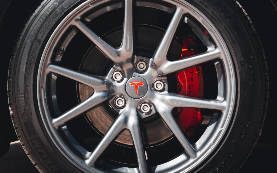 Close-up of a Zhongyu Black Car Wheel Center Cap Kit for Tesla Model 3 with the text "RADIAR EM" on it.
